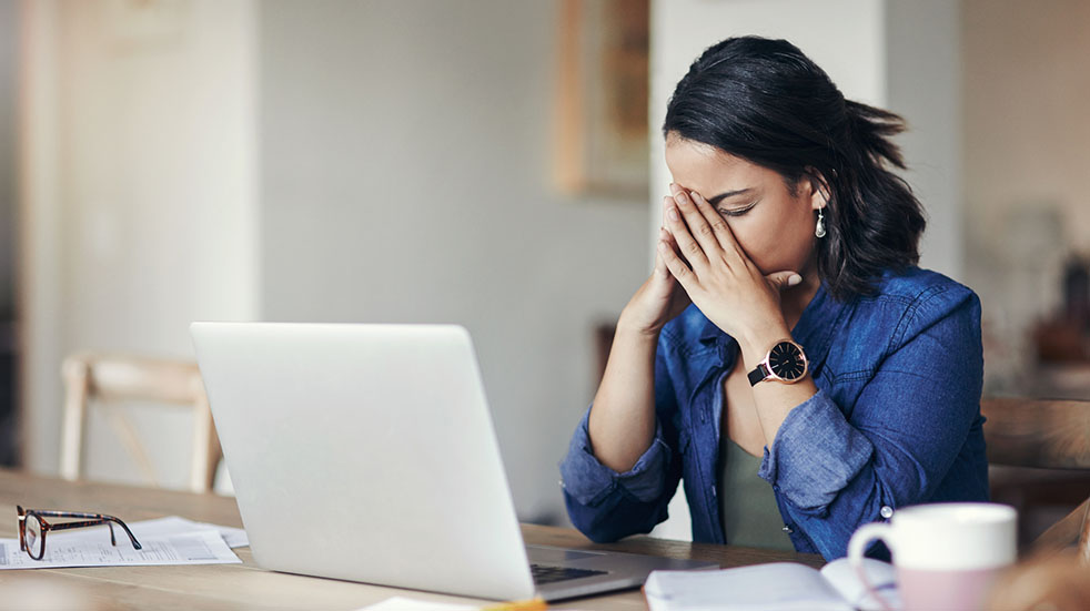 Summer holiday dilemma; woman at desk